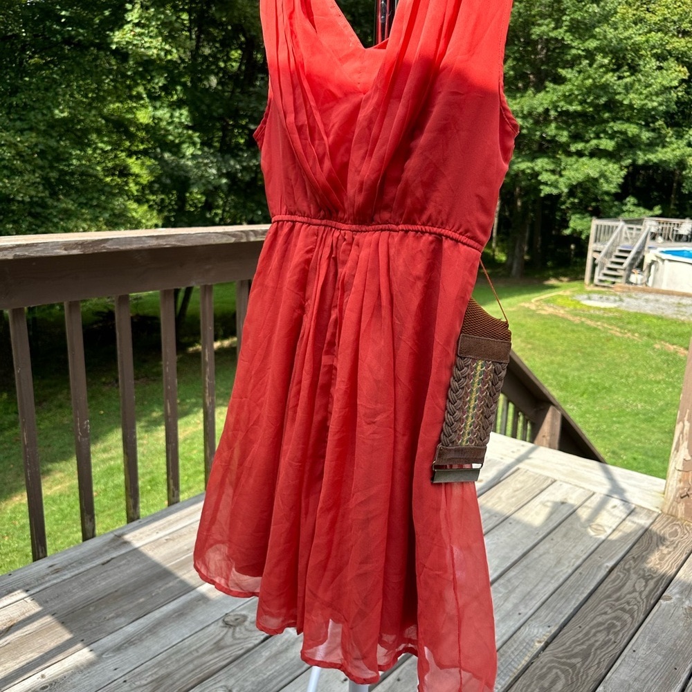 Rachael & Chloe fully lined flowey sleeveless V neck dress.